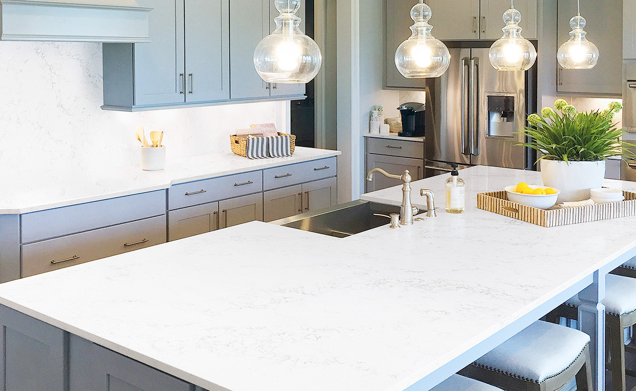 Beautiful kitchen featuring pendant lighting and Chantilly HanStone Quartz countertops
